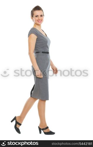 Walking elegant business woman in dress