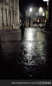 Walking on a Rainy Street at Night