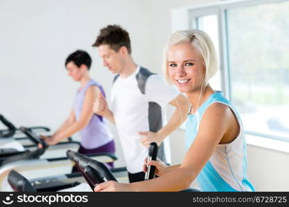 Walking on treadmill young people running exercise at fitness center