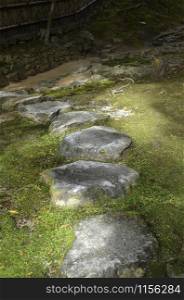 Walking path made of big stones in a Japanese garden