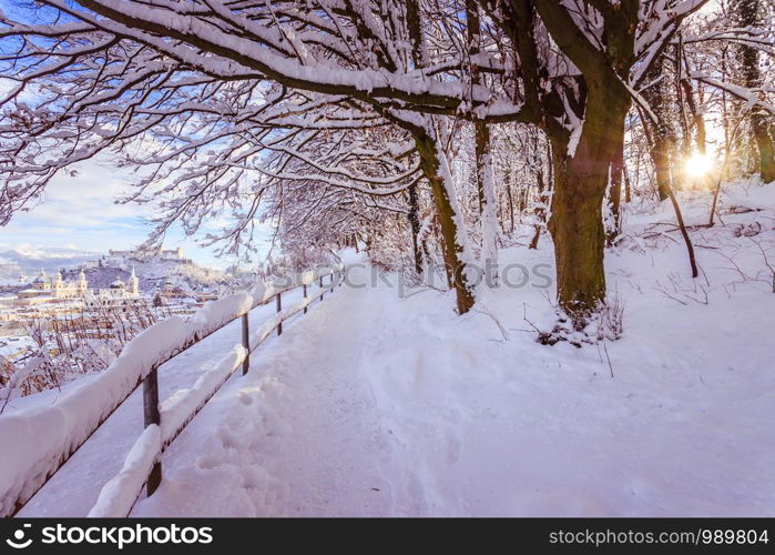 Walking promenade in Salzburg, snowy winter landscape