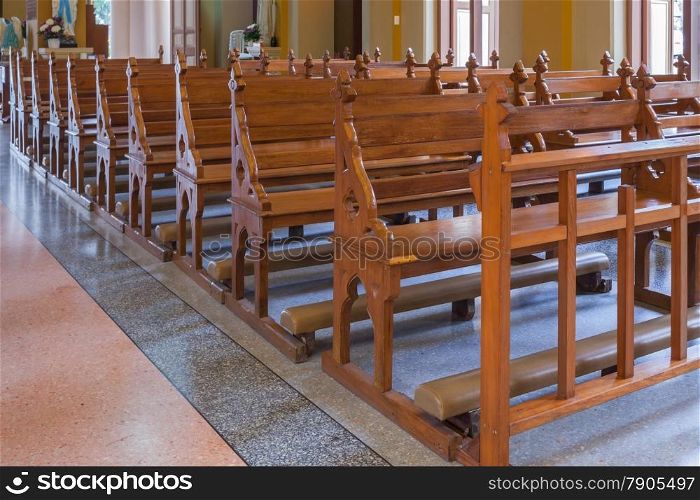 Walkway and Wood Bench of Catholic church, people can pray for god jesus