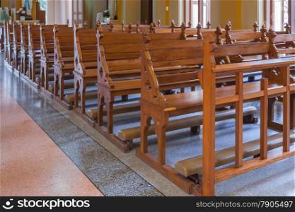 Walkway and Wood Bench of Catholic church, people can pray for god jesus