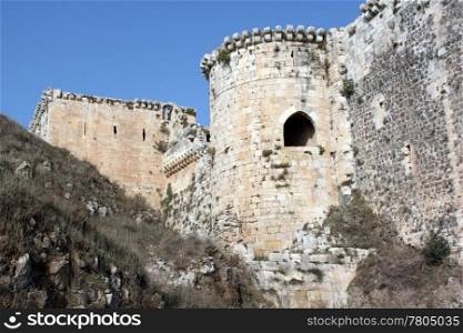 Wall and tower of castle Krak de Chevalier in Syria
