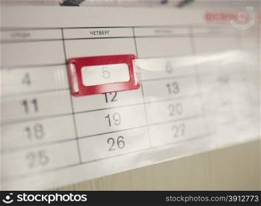 Wall calendar calendar with the number of days close-up. Tinted photo