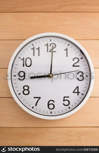 wall clock on wooden background