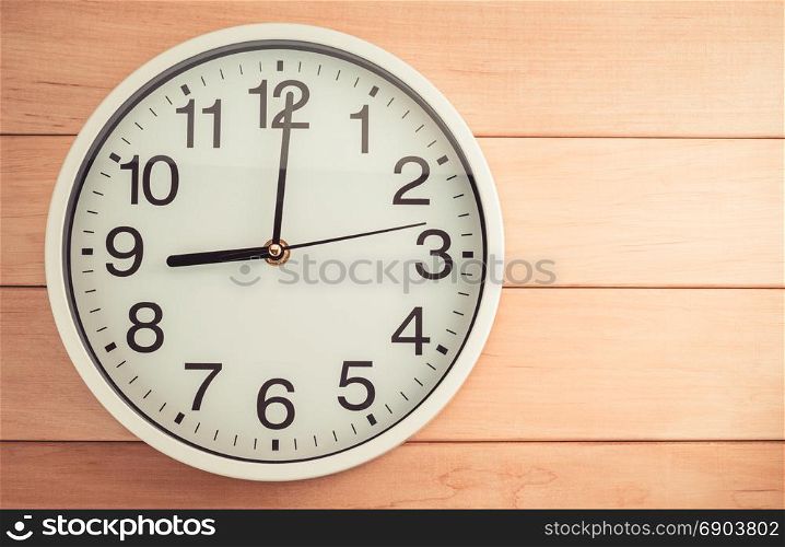 wall clock on wooden background