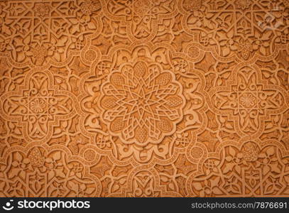 Wall detail of Alhambra UNESCO site in Granada - South of Spain. 600 years old arabic characters.