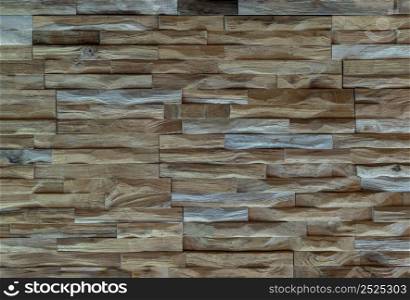 Wall made of hardwood logs. The brown wood texture background,Rustic interior design and an eco-friendly, Copy space, Focus and blur.