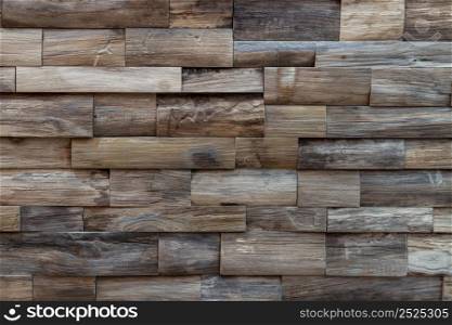 Wall made of hardwood logs. The brown wood texture background,Rustic interior design and an eco-friendly, Copy space, Focus and blur.
