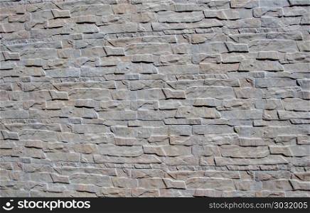 Wall made of the same type of stones. Wall made of the same type and same color of stones