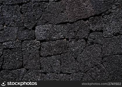 Wall made of typical arid volcanic stones in Lanzarote, Canary Islands, Spain