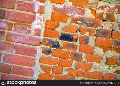 wall of bricks of different shape and colour