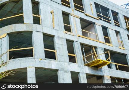 Wall of concrete building. Construction works. Industrial scene.. Wall of concrete building construction. Industrial