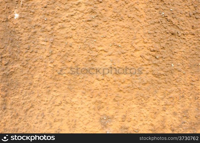 Wall of concrete with brown coating. Wall of concrete with spoiled coating