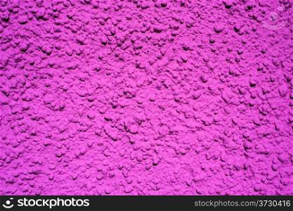 Wall of concrete with violet coating