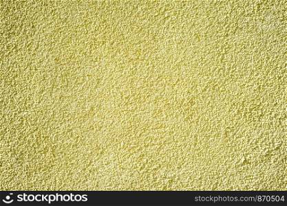 Wall of concrete with yellow coating