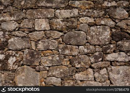 Wall of granite stone in a small village in the northwest of Spain