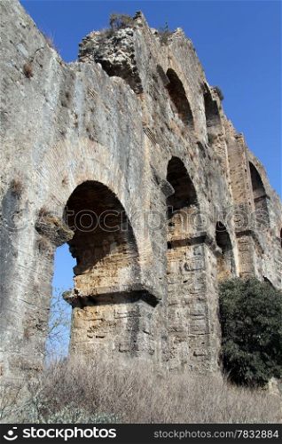 Wall of old ruined aquaduct near Aspendos, Turkey