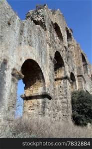 Wall of old ruined aquaduct near Aspendos, Turkey