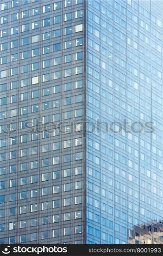 Wall of skyscraper with great number of windows. Architecture background.