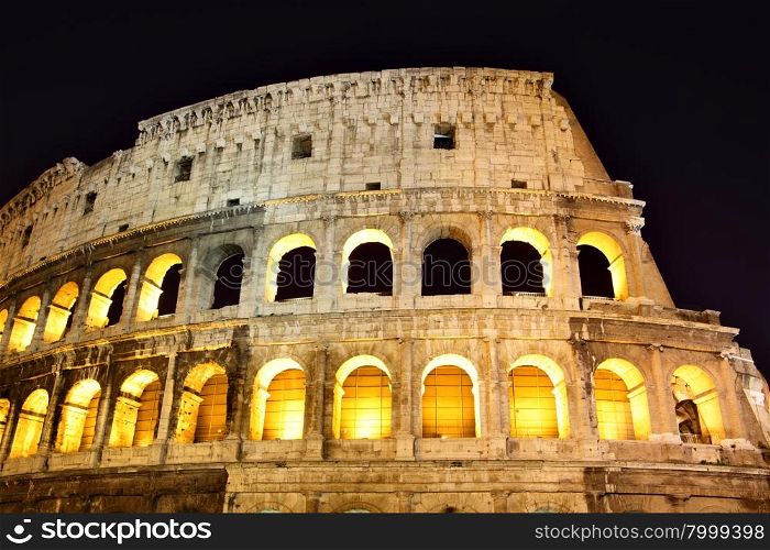 Wall of The Colosseum at night, Rome, Italy