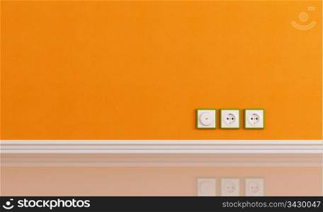 Wall outlets on the orange wall in a empty room - rendering
