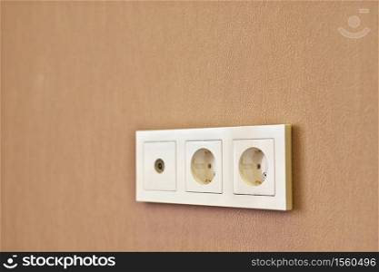 Wall socket and wall. Shallow depth-of-field. After repair scene.