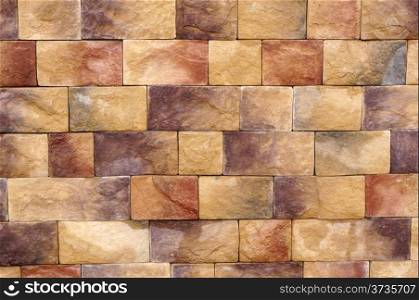 Wall texture of different colored stone blocks