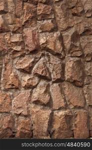 Wall texture of granite cobblestone closeup