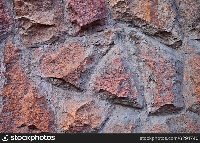 Wall texture of granite cobblestone closeup