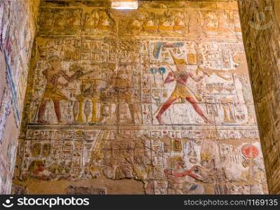 Wall with hieroglyphs in ruined Karnak Temple, Luxor