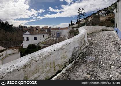Walled pavement in hill town,Granada,Spain