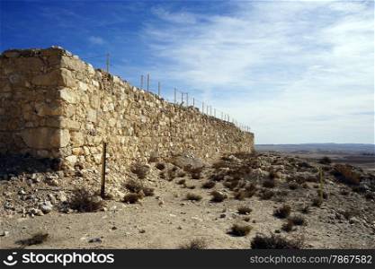 Walll of ruined castle on the top of Tel Arad hill in Israel
