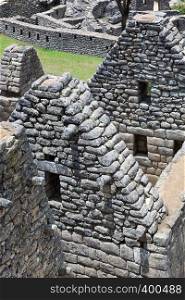 walls and ancient houses to Machu Picchu