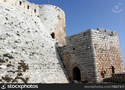 Walls of castle Krak de Chevalier in Syria
