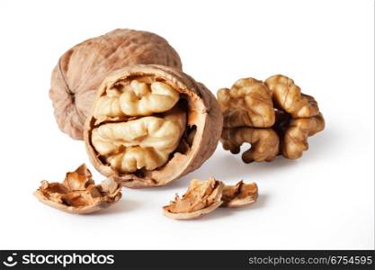 walnut and a cracked walnut isolated on the white background