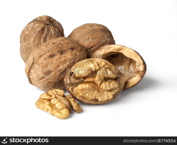 walnut and a cracked walnut isolated on the white background with clipping past