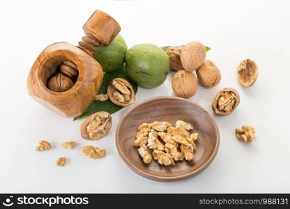 Walnut and chopped walnut. Close up. Juglans regia