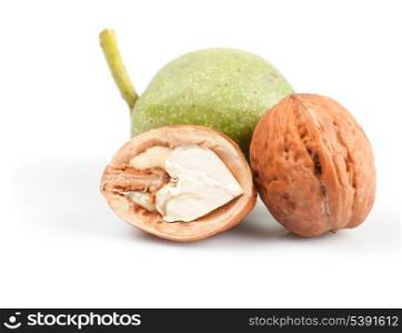 walnut and part of fresh nut isolated on white background