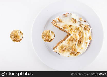 Walnut cake in plate over white background