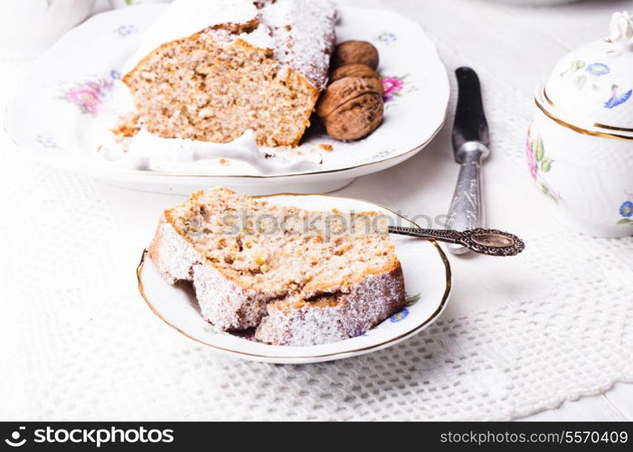 Walnut cake, piece on the plate, close up