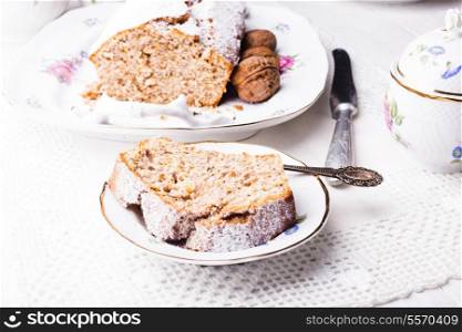 Walnut cake, piece on the plate, close up