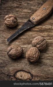 walnut. few walnuts on wooden background from autumn harvest.