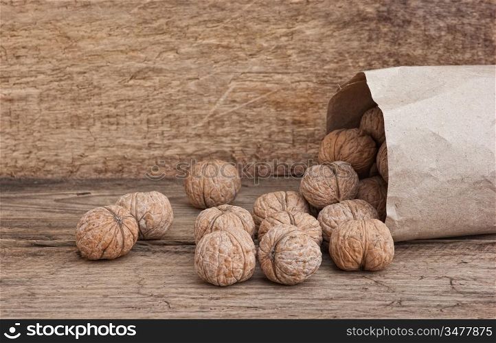 walnuts in a brown kraft paper bag