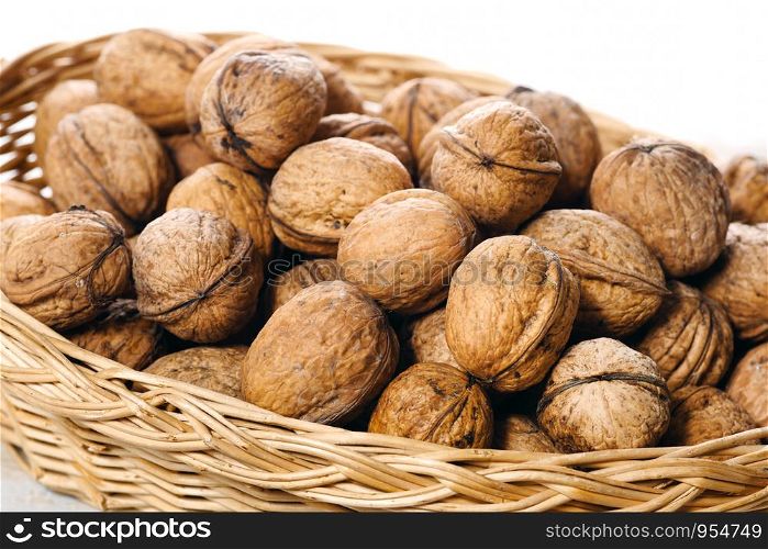 walnuts in a small wicker basket