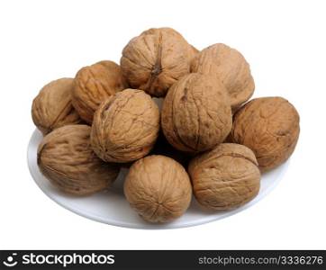 Walnuts in a white plate on a white background, isolated