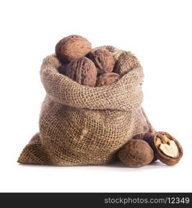 Walnuts in burlap bag isolated on white