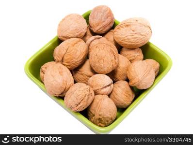 walnuts in plate isolated na white background