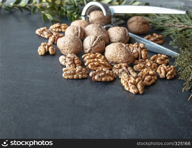 Walnuts on a black background, walnut kernels. Healthy food from walnut. Close-up.